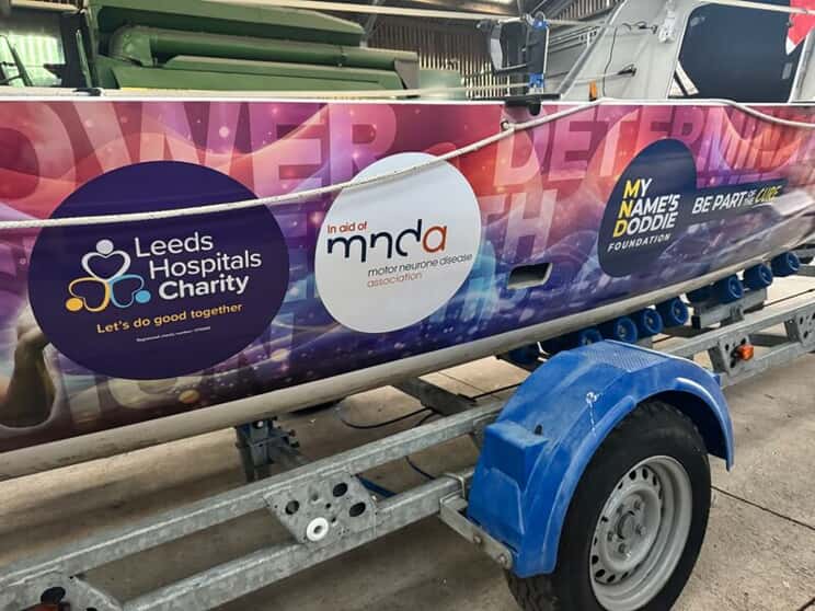 An image of the colorful vinyl wrap on the other side of the boat.